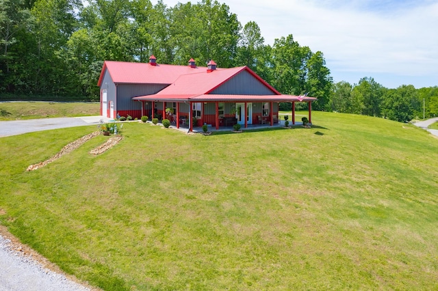 4499 Benson Rd, Springfield, TN 37172 - farmhouse featuring covered porch, driveway, a front yard, metal roof, and a chimney