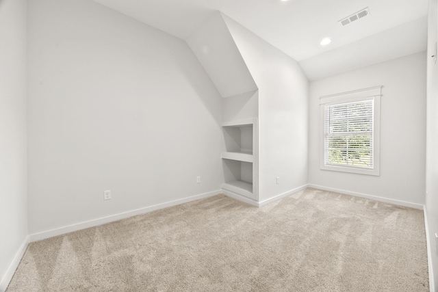 2107 Kidd Rd, Nolensville, TN 37135 - carpeted empty room with baseboards, vaulted ceiling, built in shelves, and recessed lighting