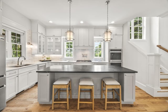 2107 Kidd Rd, Nolensville, TN 37135 - kitchen featuring a sink, light wood finished floors, white cabinets, and recessed lighting