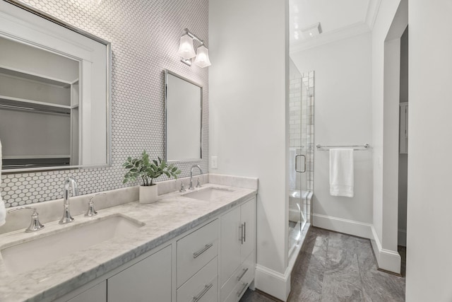2107 Kidd Rd, Nolensville, TN 37135 - bathroom with baseboards, double vanity, a shower stall, ornamental molding, and backsplash