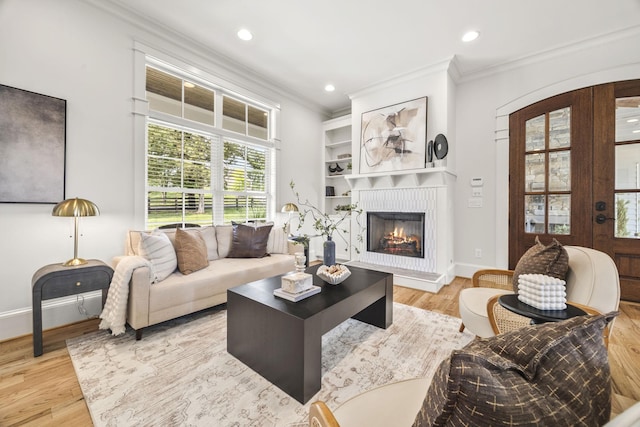 2107 Kidd Rd, Nolensville, TN 37135 - living area with ornamental molding, a fireplace, light wood-style flooring, recessed lighting, and baseboards