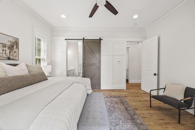 2107 Kidd Rd, Nolensville, TN 37135 - bedroom featuring a barn door, ornamental molding, light wood-type flooring, a ceiling fan, and recessed lighting