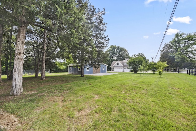 2107 Kidd Rd, Nolensville, TN 37135 - view of green lawn featuring a garage and an outdoor structure