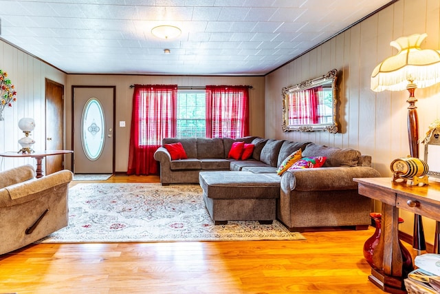 406 Longview St, Camden, TN 38320 - living area featuring plenty of natural light, ornamental molding, wood finished floors, and wooden walls