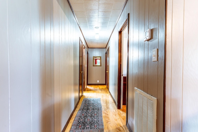 406 Longview St, Camden, TN 38320 - corridor featuring light wood finished floors and wood walls