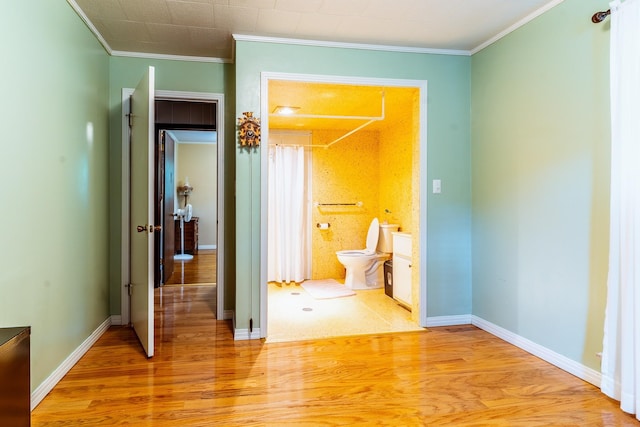406 Longview St, Camden, TN 38320 - hall featuring crown molding, light wood finished floors, and baseboards
