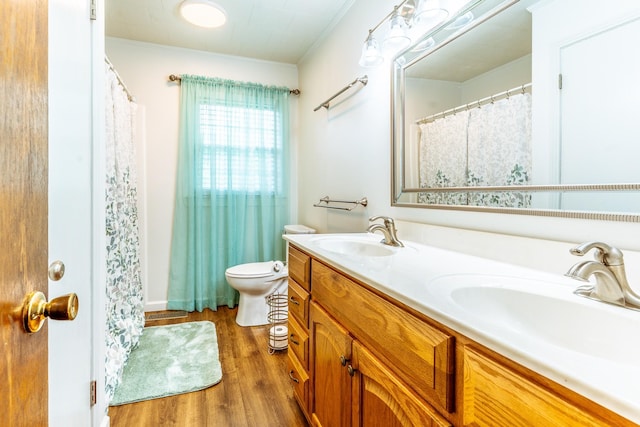 406 Longview St, Camden, TN 38320 - bathroom featuring wood finished floors, double vanity, crown molding, and toilet
