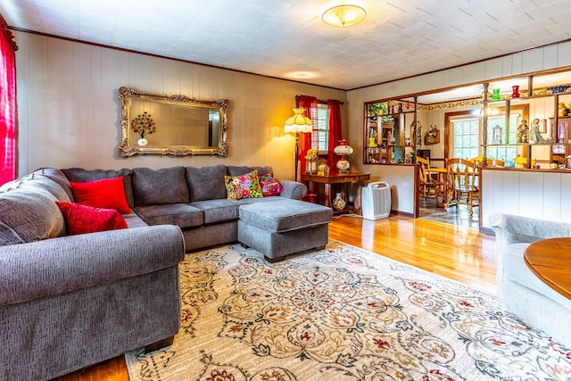 406 Longview St, Camden, TN 38320 - living room with wood finished floors, crown molding, and wood walls