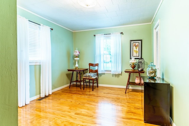 406 Longview St, Camden, TN 38320 - sitting room featuring ornamental molding, wood finished floors, and baseboards