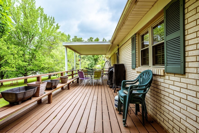 406 Longview St, Camden, TN 38320 - wooden terrace with outdoor dining area