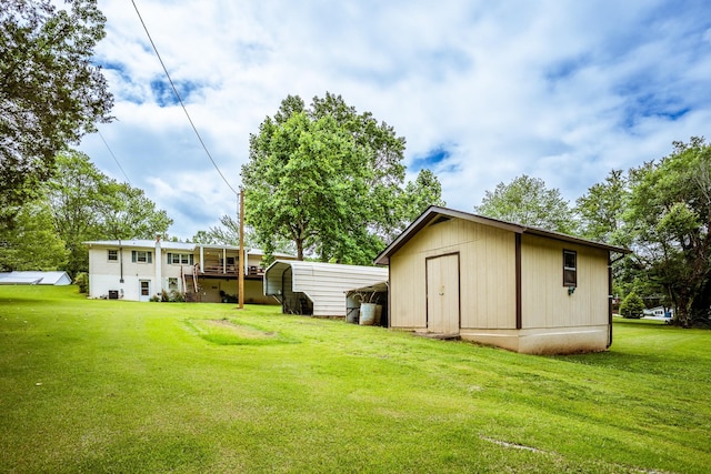 406 Longview St, Camden, TN 38320 - view of green lawn with a carport
