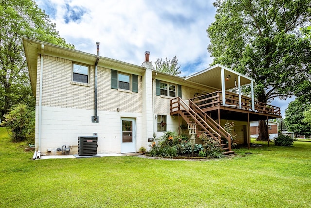 406 Longview St, Camden, TN 38320 - rear view of house featuring central air condition unit, stairs, a deck, a yard, and brick siding