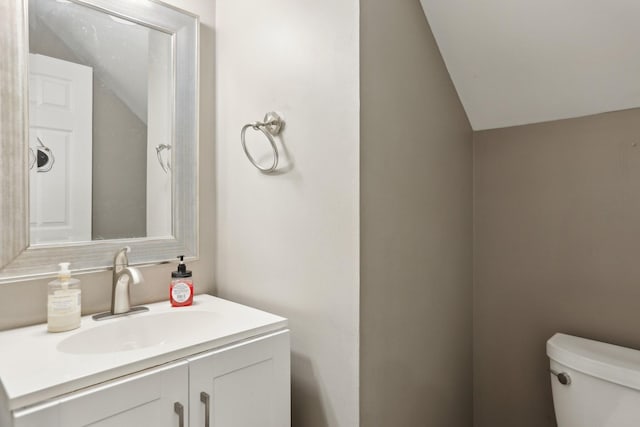 5720 Saint Charles Ct, Hermitage, TN 37076 - bathroom with vaulted ceiling, toilet, and vanity