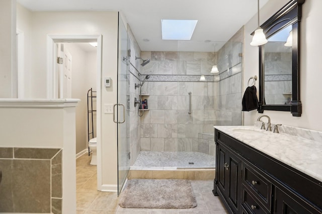 5720 Saint Charles Ct, Hermitage, TN 37076 - full bathroom with toilet, a shower stall, vanity, tile patterned flooring, and a skylight