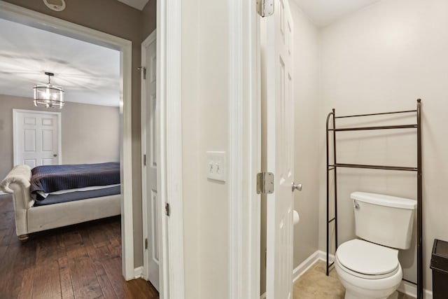 5720 Saint Charles Ct, Hermitage, TN 37076 - bathroom featuring hardwood / wood-style flooring, toilet, ensuite bathroom, and baseboards