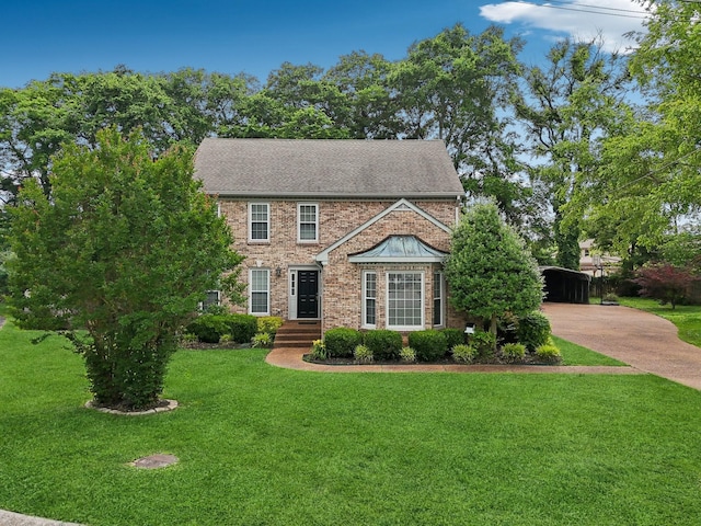 5720 Saint Charles Ct, Hermitage, TN 37076 - view of front of home with a front lawn, a detached carport, concrete driveway, and brick siding