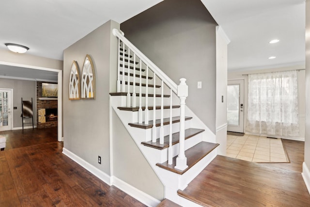 5720 Saint Charles Ct, Hermitage, TN 37076 - stairway with healthy amount of natural light, a fireplace, wood-type flooring, and recessed lighting