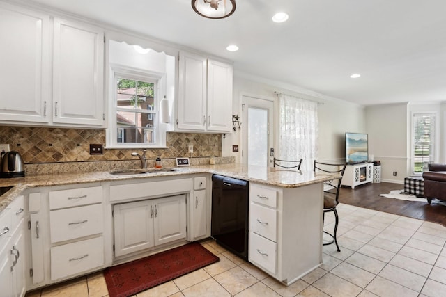 5720 Saint Charles Ct, Hermitage, TN 37076 - kitchen with black dishwasher, a sink, a peninsula, decorative backsplash, and recessed lighting