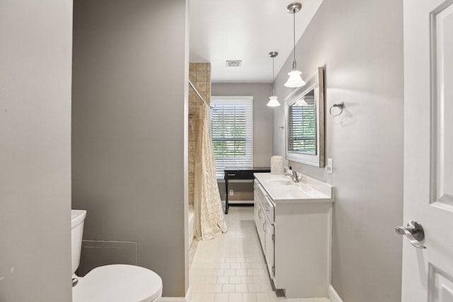 5720 Saint Charles Ct, Hermitage, TN 37076 - bathroom with toilet, vanity, shower / bath combo with shower curtain, and baseboards