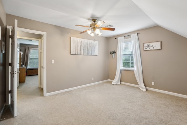 5720 Saint Charles Ct, Hermitage, TN 37076 - unfurnished bedroom featuring light carpet, baseboards, lofted ceiling, and ceiling fan