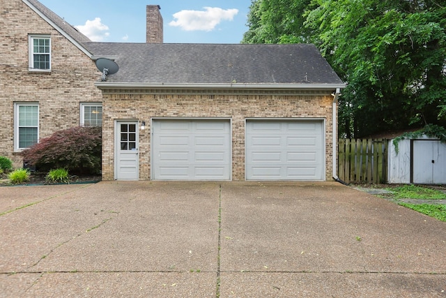 5720 Saint Charles Ct, Hermitage, TN 37076 - garage with driveway and a storage shed
