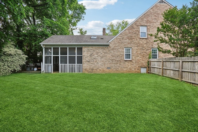 5720 Saint Charles Ct, Hermitage, TN 37076 - rear view of house with a chimney, brick siding, a sunroom, and roof with shingles