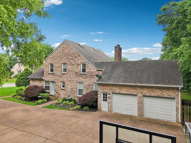 5720 Saint Charles Ct, Hermitage, TN 37076 - traditional-style house with a chimney, brick siding, driveway, and a shingled roof