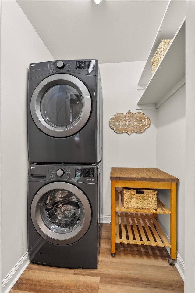 440 Ridgestone Dr, Franklin, TN 37064 - laundry room with estacked washer and dryer and wood finished floors