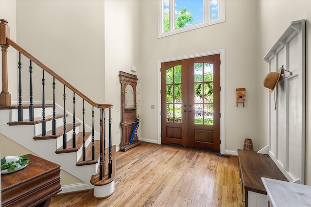 440 Ridgestone Dr, Franklin, TN 37064 - foyer with a towering ceiling, light wood-style floors, and stairway