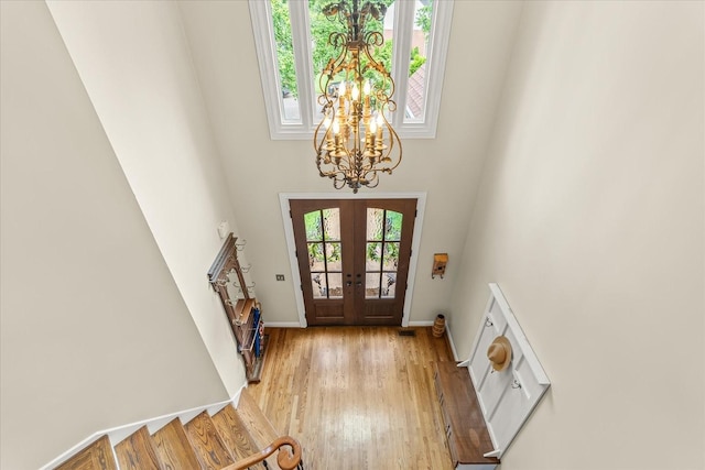 440 Ridgestone Dr, Franklin, TN 37064 - entryway featuring a chandelier, a towering ceiling, french doors, stairway, and light wood-style floors