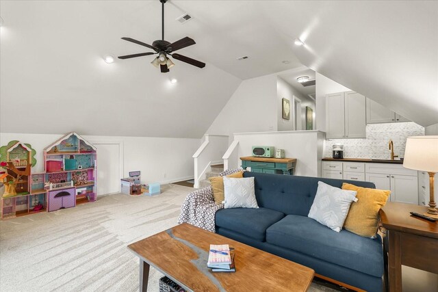 440 Ridgestone Dr, Franklin, TN 37064 - living room with ceiling fan, lofted ceiling, light carpet, and stairs
