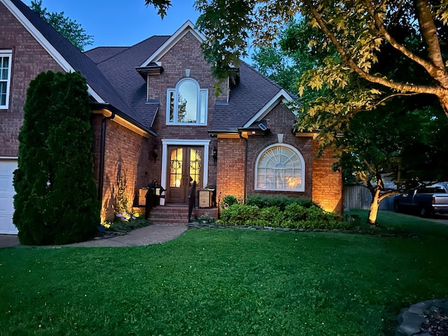 440 Ridgestone Dr, Franklin, TN 37064 - view of front of home featuring brick siding, french doors, a front lawn, and roof with shingles