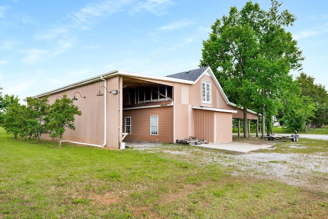 5740 Johnson Rd, Murfreesboro, TN 37127 - back of house with a lawn and an outbuilding