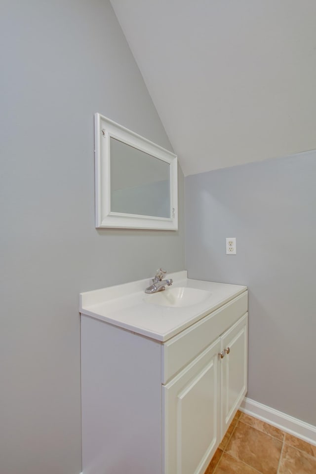 5740 Johnson Rd, Murfreesboro, TN 37127 - bathroom featuring vaulted ceiling, vanity, tile patterned floors, and baseboards