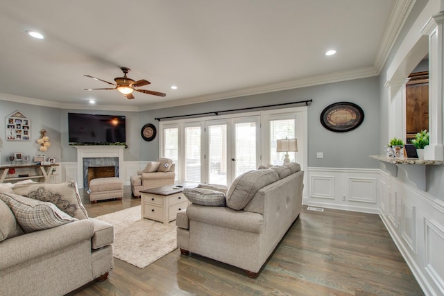 5740 Johnson Rd, Murfreesboro, TN 37127 - living room with a high end fireplace, a ceiling fan, a decorative wall, ornamental molding, and wainscoting