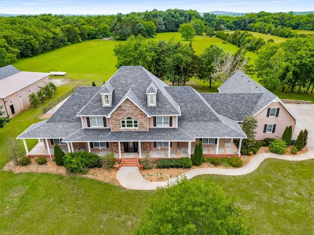 5740 Johnson Rd, Murfreesboro, TN 37127 - view of front of property with a porch, a front yard, and brick siding