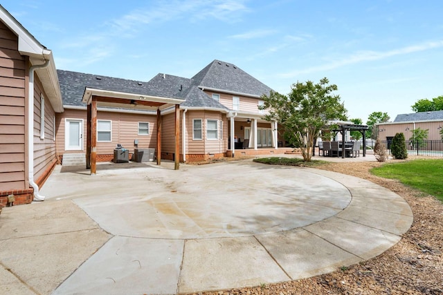 5740 Johnson Rd, Murfreesboro, TN 37127 - rear view of property featuring a pergola, roof with shingles, and a patio