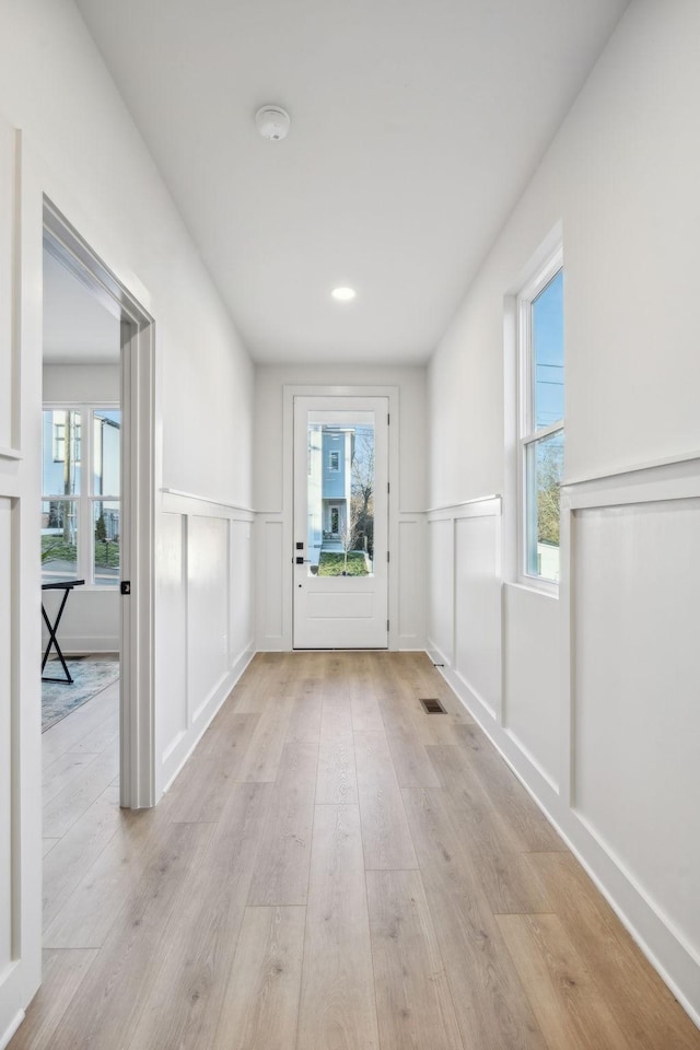 1734A Kellow St, Nashville, TN 37208 - interior space with light wood-type flooring, wainscoting, and a decorative wall