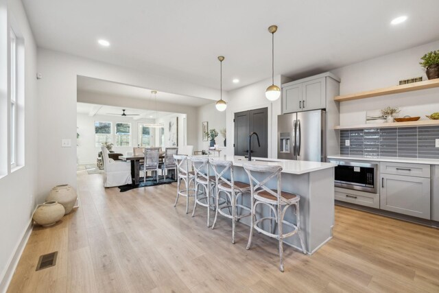 1734A Kellow St, Nashville, TN 37208 - kitchen featuring stainless steel appliances, gray cabinets, light countertops, a sink, and recessed lighting
