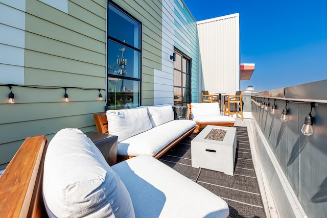1900 12th Ave S Unit 502, Nashville, TN 37203 - balcony with an outdoor living space with a fire pit