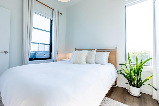 1900 12th Ave S Unit 502, Nashville, TN 37203 - bedroom featuring wood finished floors and baseboards