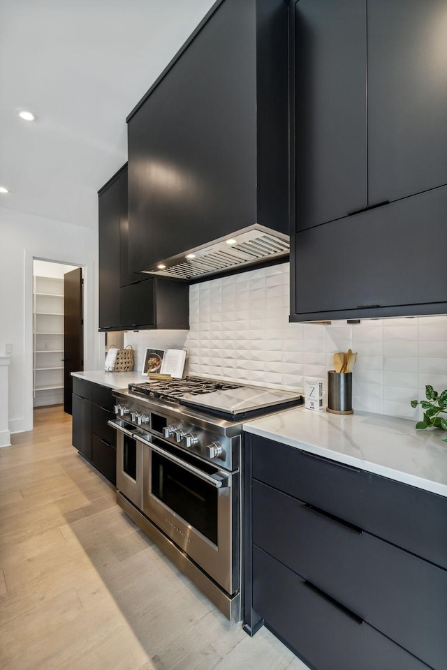 112 47th Ave N, Nashville, TN 37209 - kitchen with double oven range, dark cabinets, modern cabinets, backsplash, and recessed lighting
