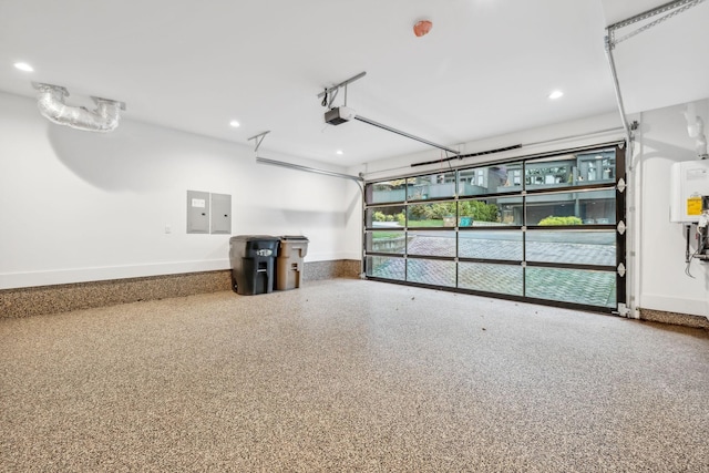 112 47th Ave N, Nashville, TN 37209 - garage featuring a garage door opener, water heater, baseboards, recessed lighting, and electric panel