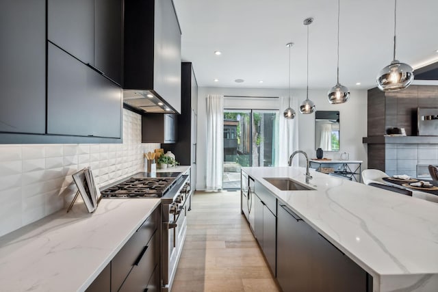 112 47th Ave N, Nashville, TN 37209 - kitchen featuring a sink, double oven range, wall chimney range hood, modern cabinets, and recessed lighting