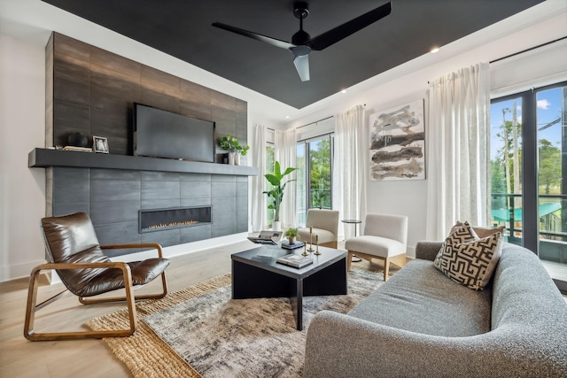 112 47th Ave N, Nashville, TN 37209 - living room featuring wood finished floors, baseboards, a tile fireplace, ceiling fan, and recessed lighting