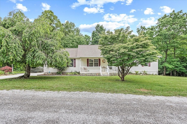 2008 Spruce Loop, Crossville, TN 38555 - view of front of house featuring a porch, a front yard, and roof with shingles