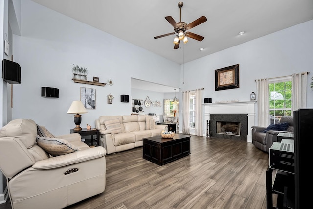116 Macy Ct, Christiana, TN 37037 - living room featuring a ceiling fan, a high ceiling, wood finished floors, and a high end fireplace