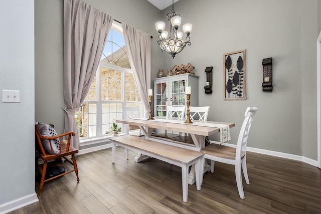 116 Macy Ct, Christiana, TN 37037 - dining room featuring a chandelier, dark wood finished floors, baseboards, and a high ceiling