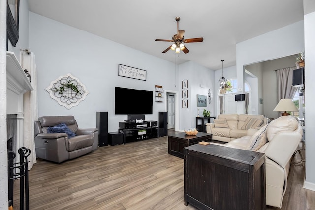 116 Macy Ct, Christiana, TN 37037 - living area with a ceiling fan, light wood finished floors, plenty of natural light, and a fireplace