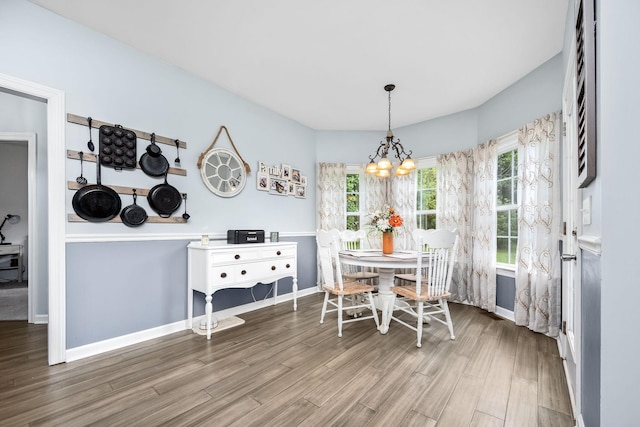 116 Macy Ct, Christiana, TN 37037 - dining area with a chandelier, wood finished floors, and baseboards